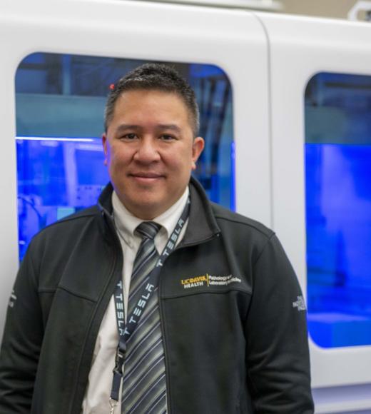 Picture of Nam in front of a train